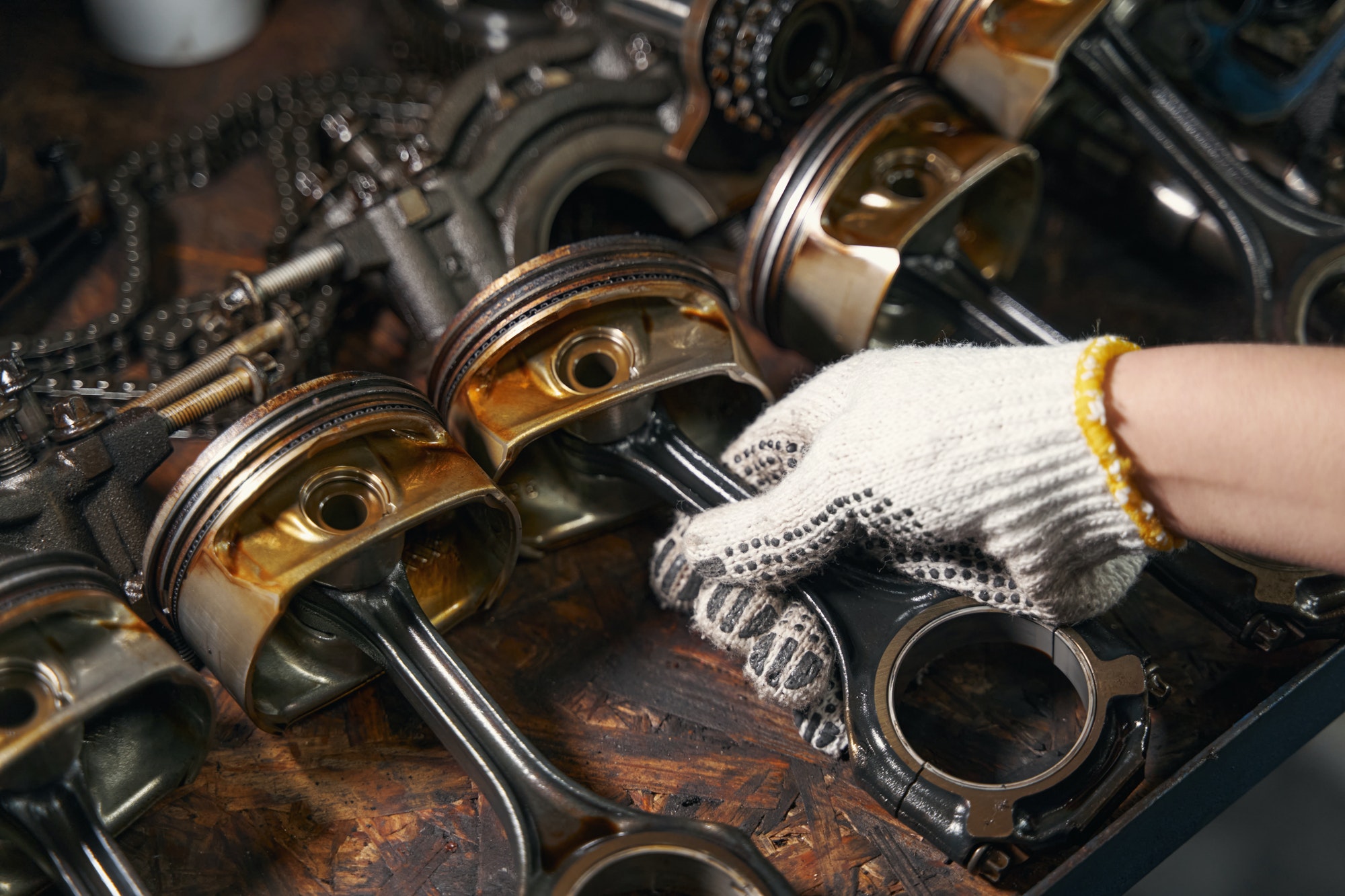 Auto mechanic repairing car parts in automobile garage